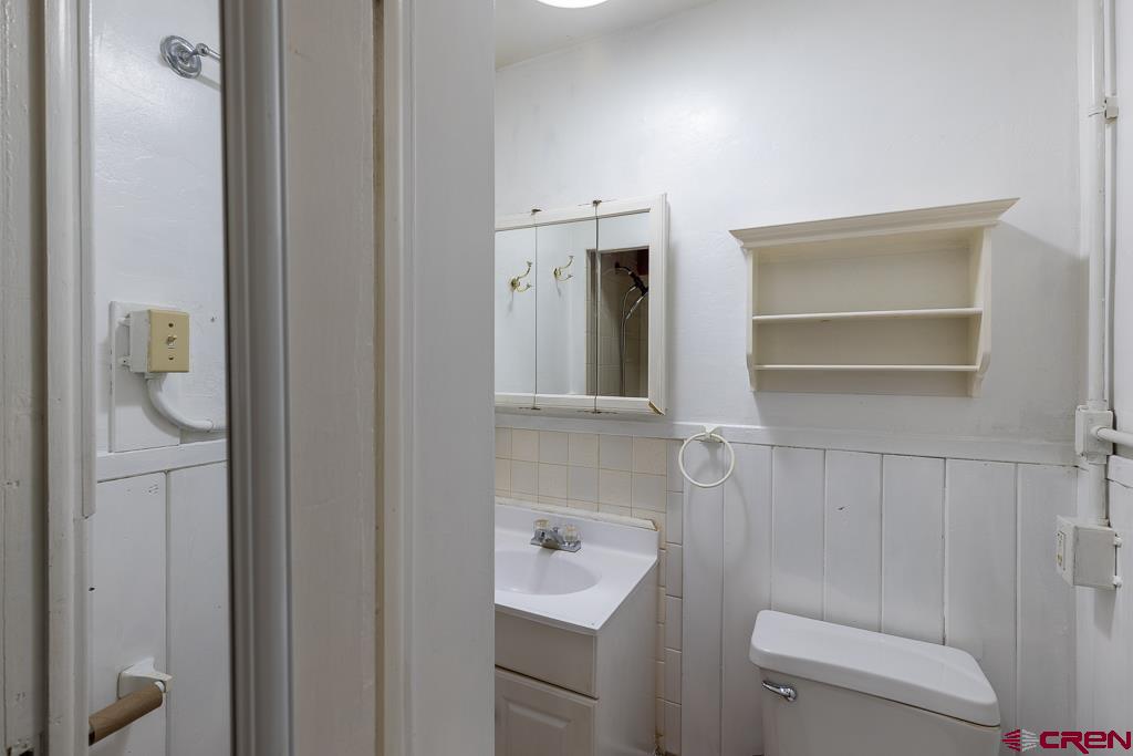 558 East 4th Avenue Durango, CO 81301 - Photo 6 of 15 a bathroom with a sink toilet and shower