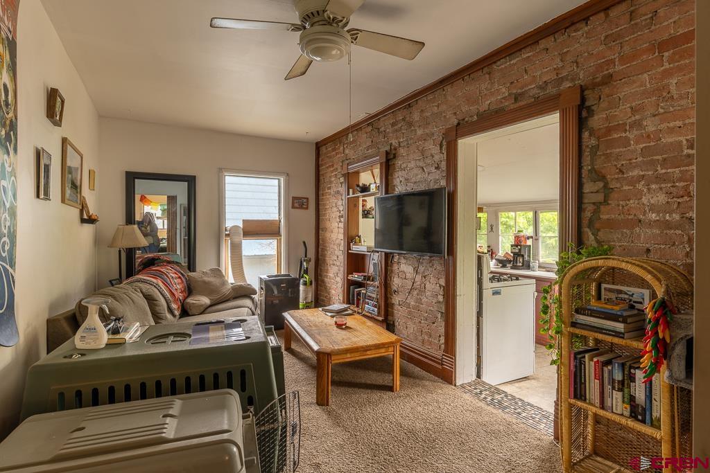558 East 4th Avenue Durango, CO 81301 - Photo 10 of 15 a living room with furniture and a wooden floor