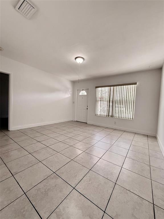 2671 Northeast 18th Terrace Lighthouse Point, FL 33064 - Photo 3 of 7 a view of an empty room and a window