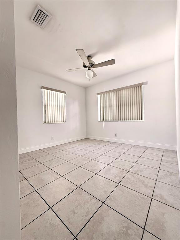 2671 Northeast 18th Terrace Lighthouse Point, FL 33064 - Photo 4 of 7 a view of an empty room and window