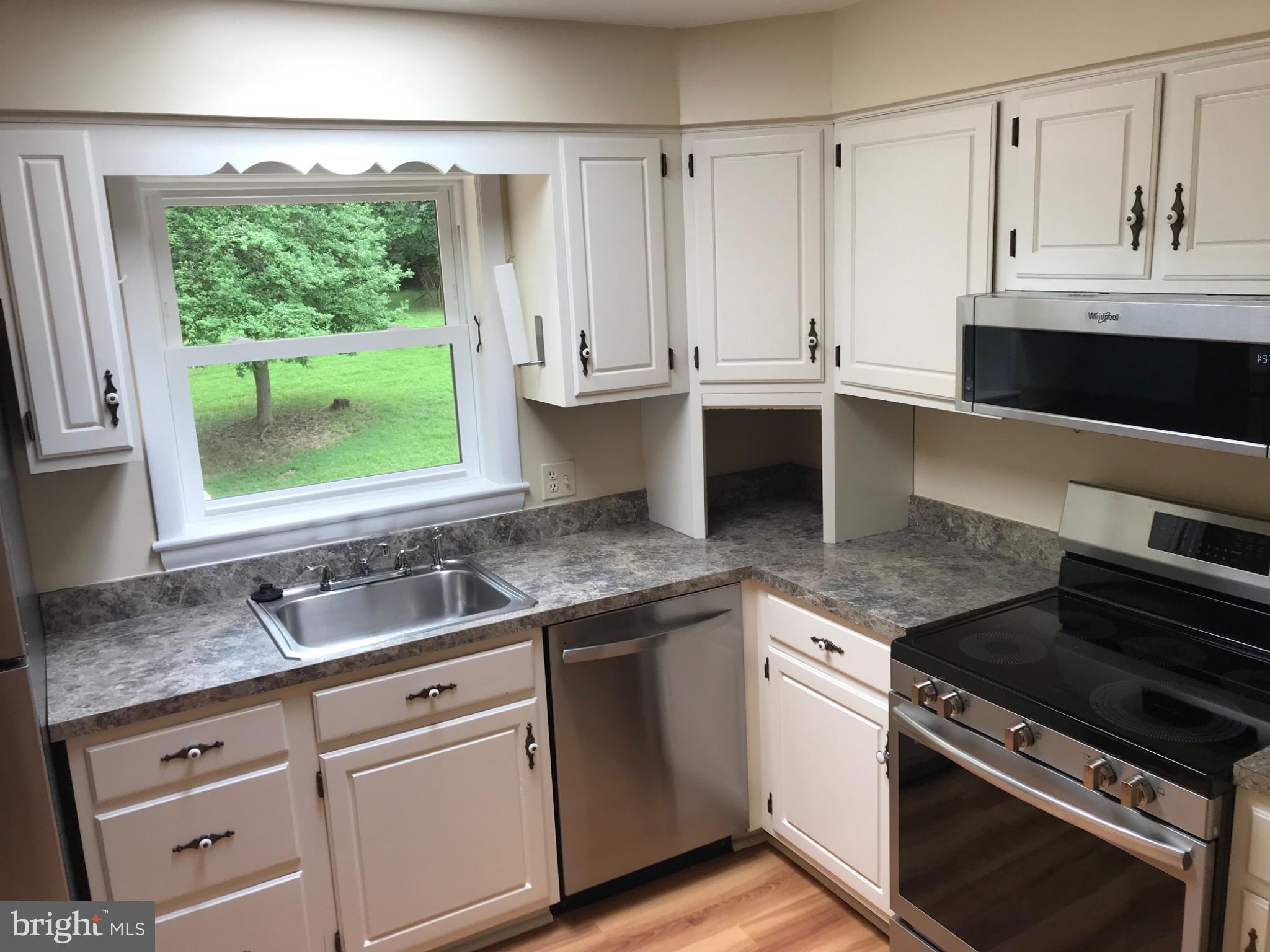 113 Kingsley Road Southwest Vienna, VA 22180 - Photo 11 of 34 Bright kitchen with scenic views.