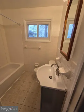 a bathroom with a sink and a bathtub