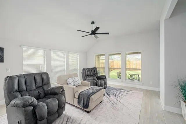 a living room with furniture and a window