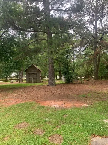 a view of an empty room with a bathroom and a bathroom
