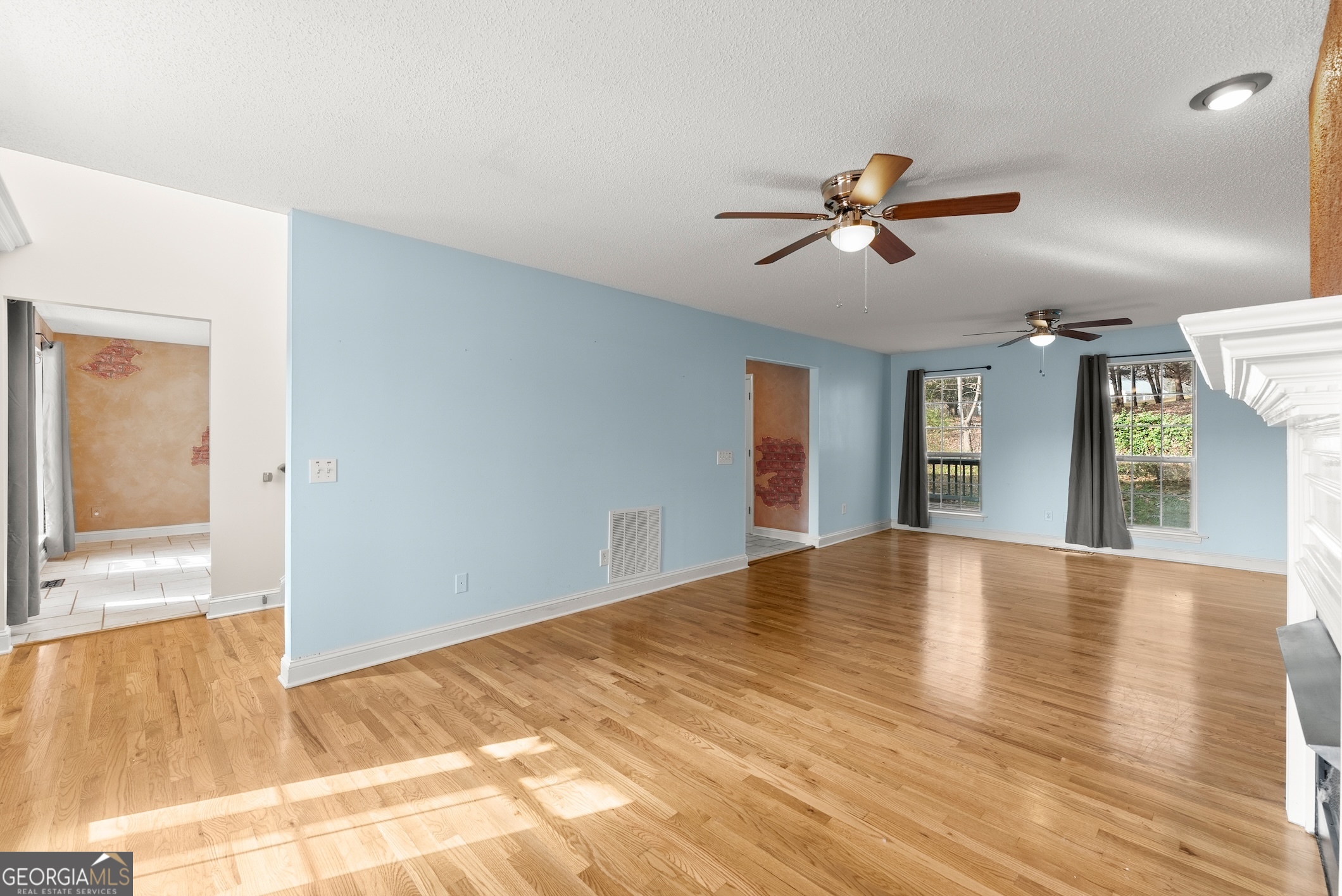 81 Heather Way Cleveland, GA 30528 - Photo 12 of 49 a view of empty room with wooden floor and fan