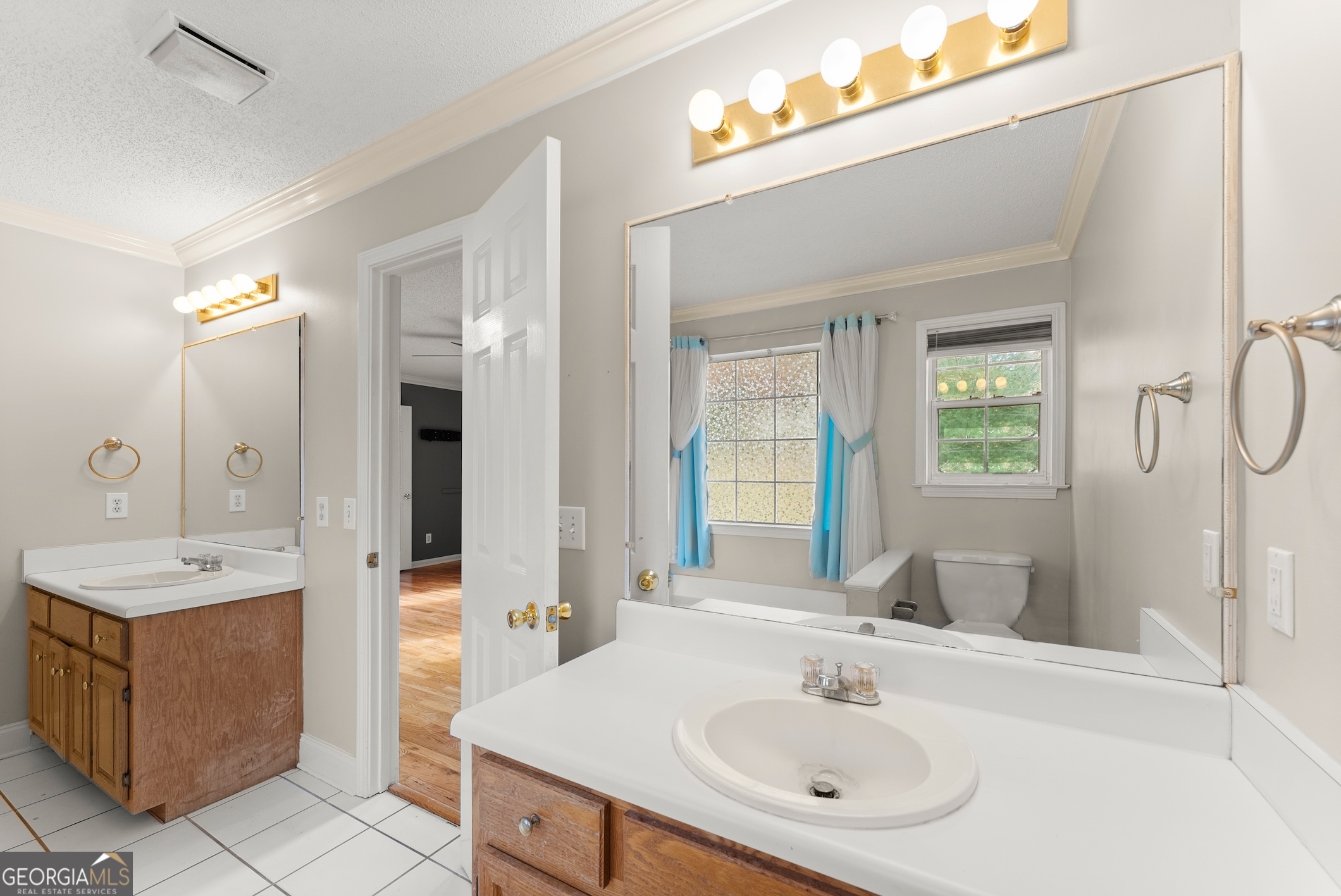 81 Heather Way Cleveland, GA 30528 - Photo 18 of 49 a bathroom with a sink tub shower and a mirror