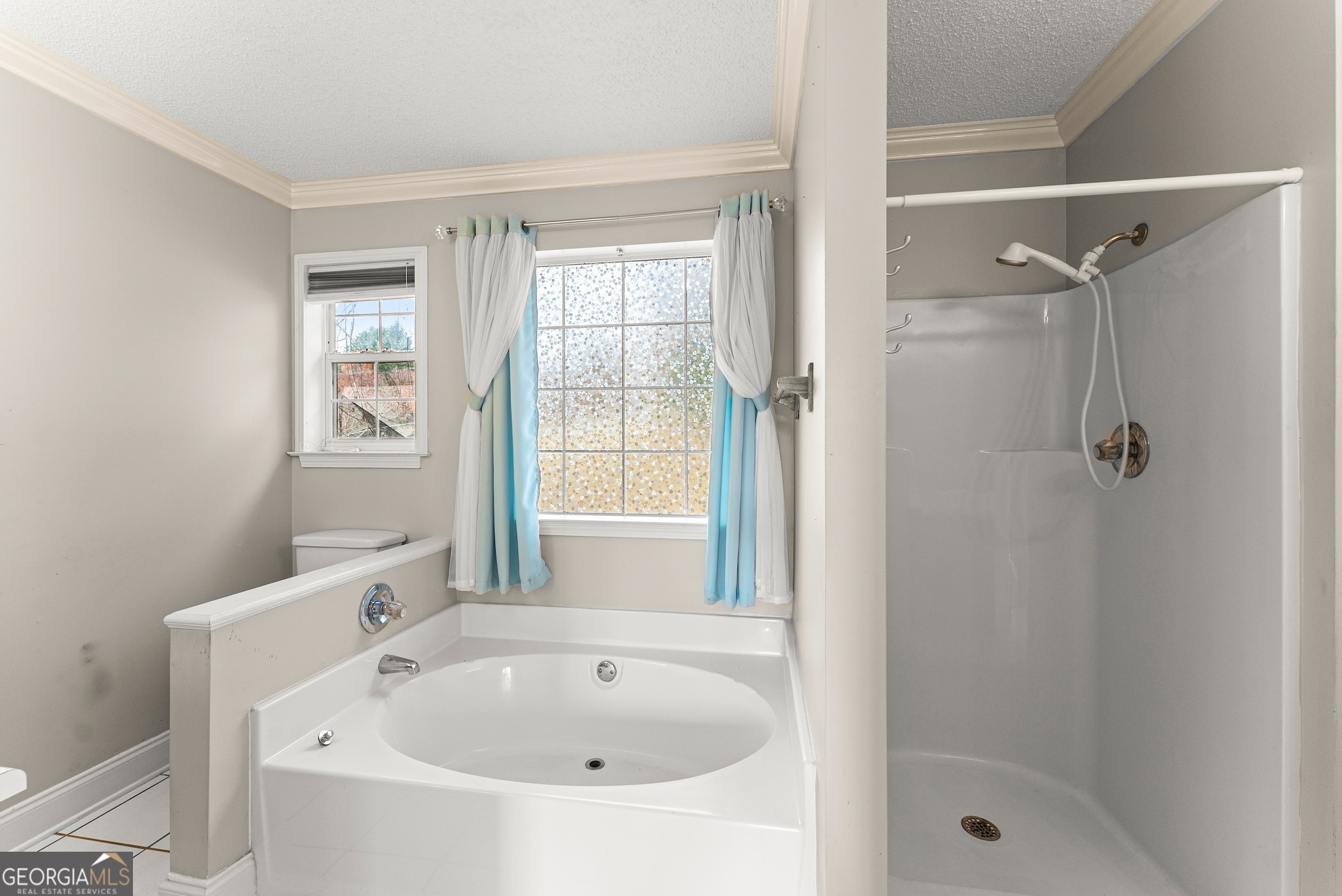 81 Heather Way Cleveland, GA 30528 - Photo 19 of 49 a white bath tub sitting next to a shower