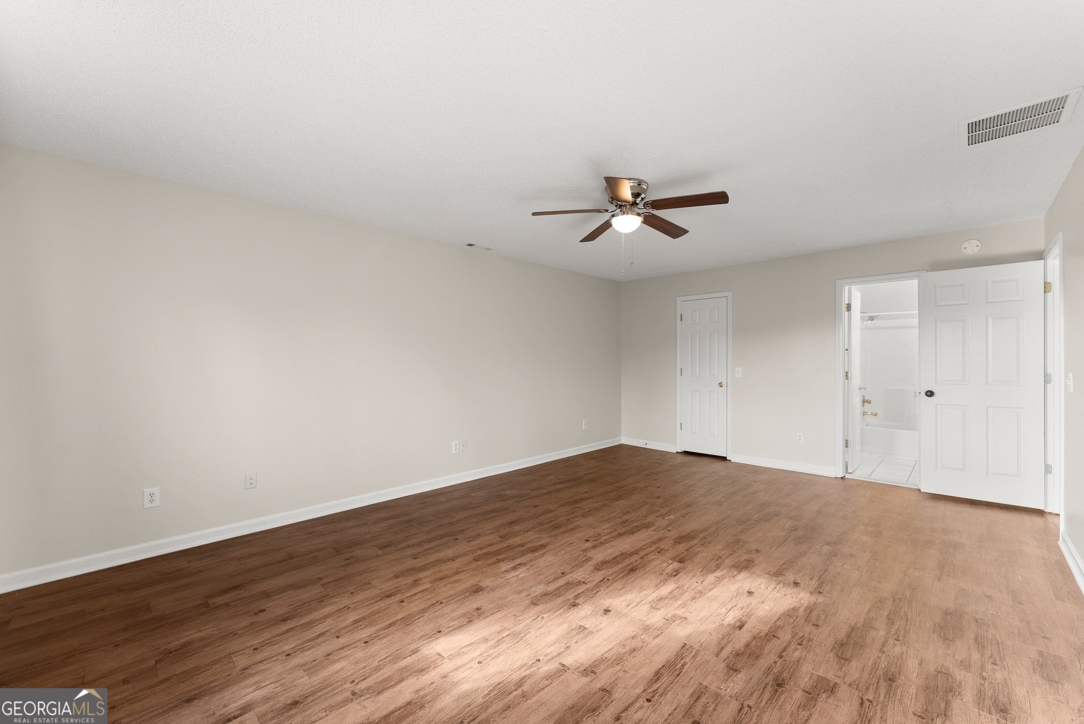 81 Heather Way Cleveland, GA 30528 - Photo 22 of 49 a view of empty room with wooden floor