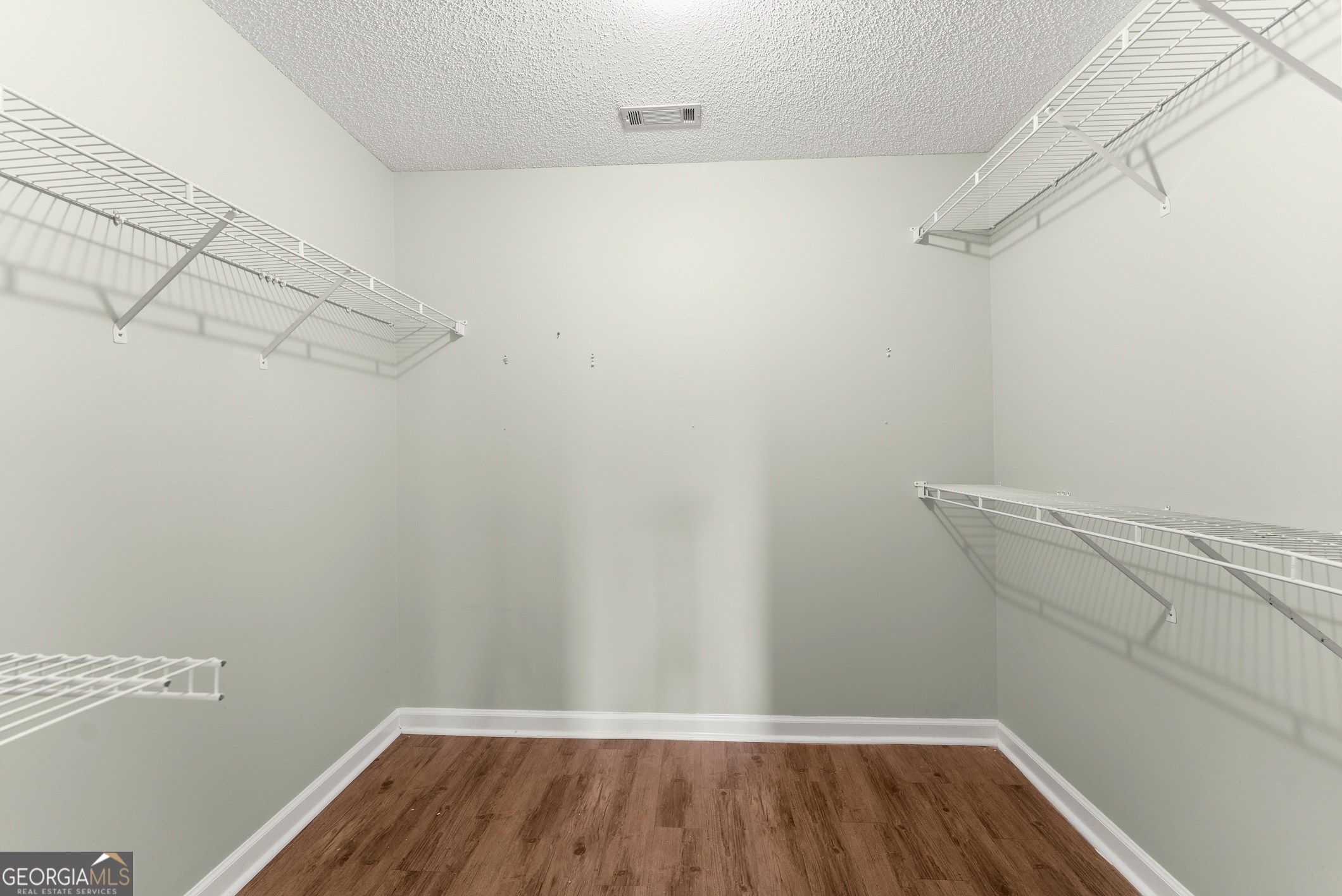 81 Heather Way Cleveland, GA 30528 - Photo 24 of 49 a view of a room with racks on the wall