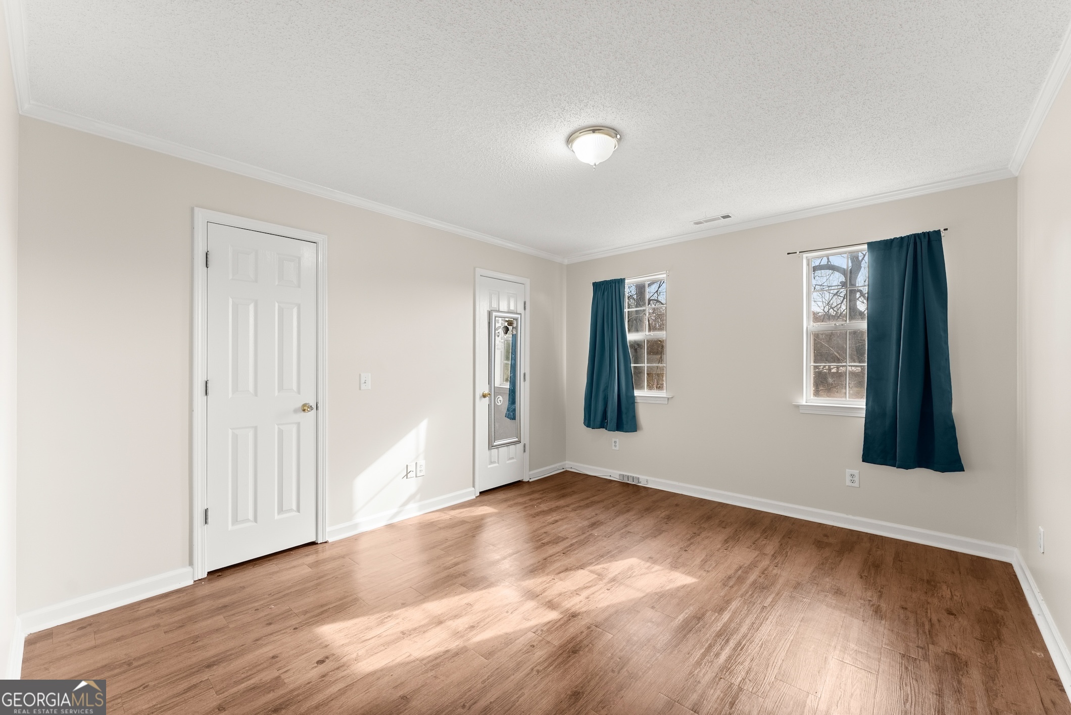81 Heather Way Cleveland, GA 30528 - Photo 28 of 49 a view of an empty room with wooden floor and a window