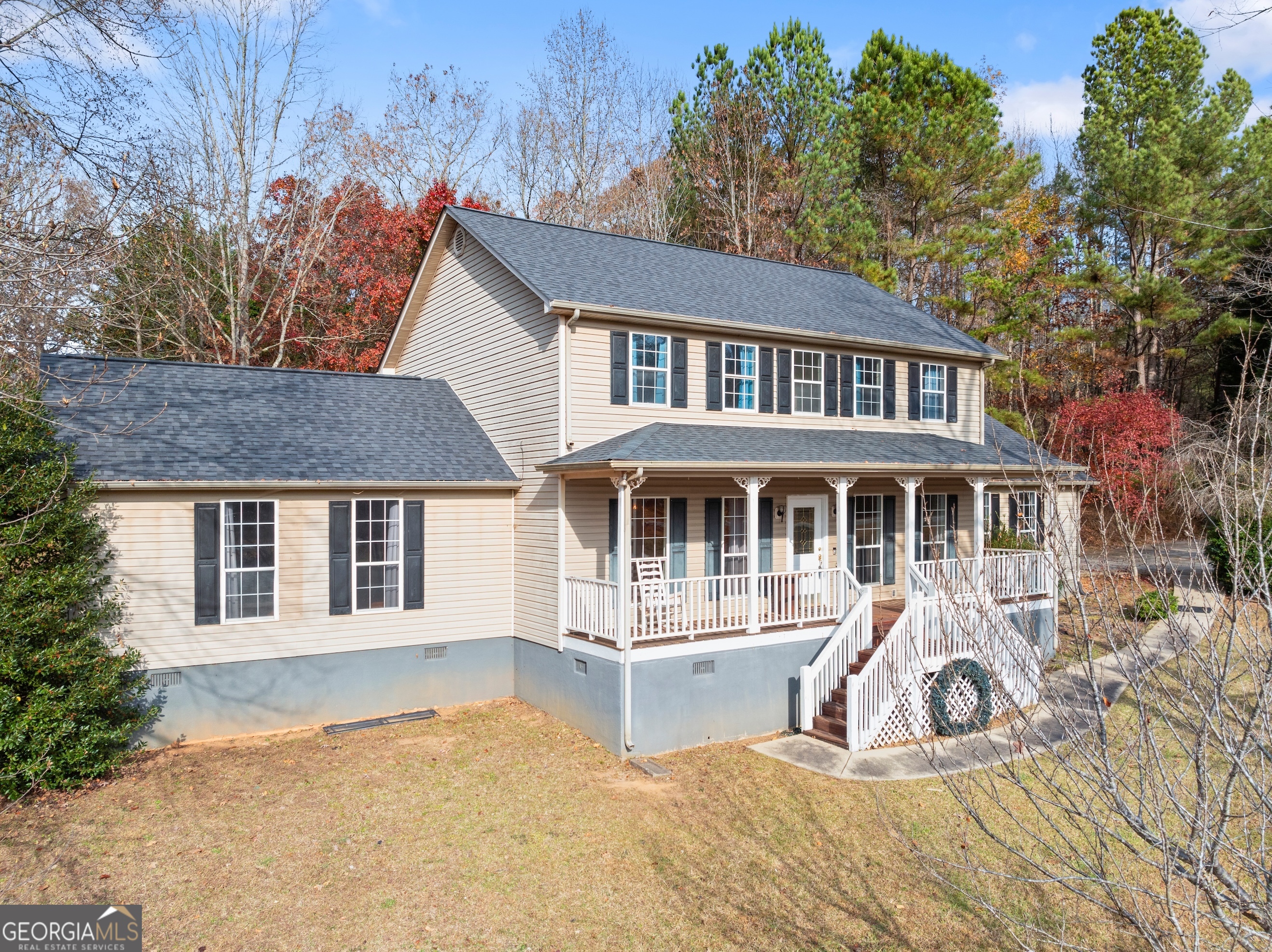 81 Heather Way Cleveland, GA 30528 - Photo 33 of 49 a front view of a house with a yard outdoor seating and garage