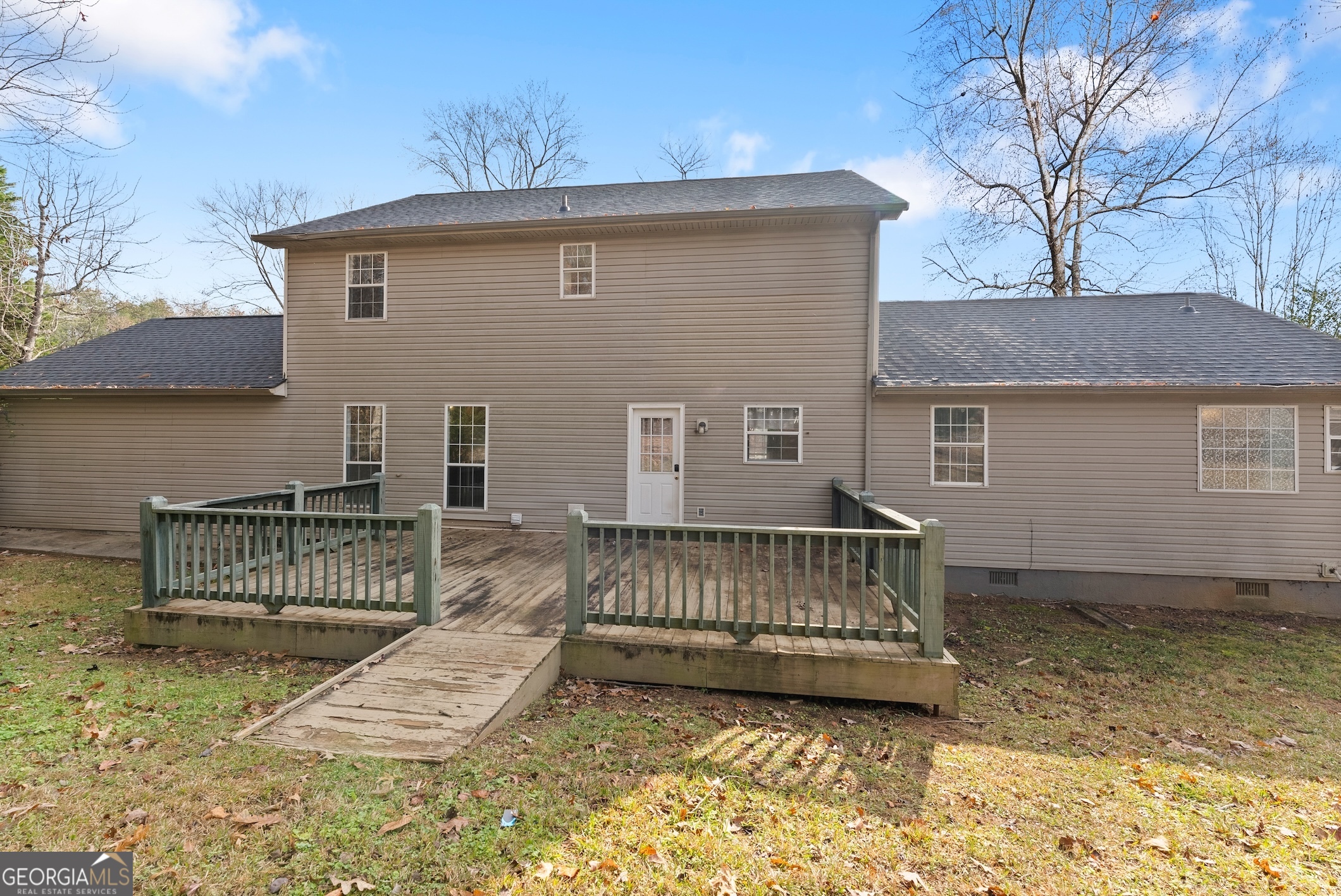 81 Heather Way Cleveland, GA 30528 - Photo 40 of 49 a view of a house with a wooden deck and a yard