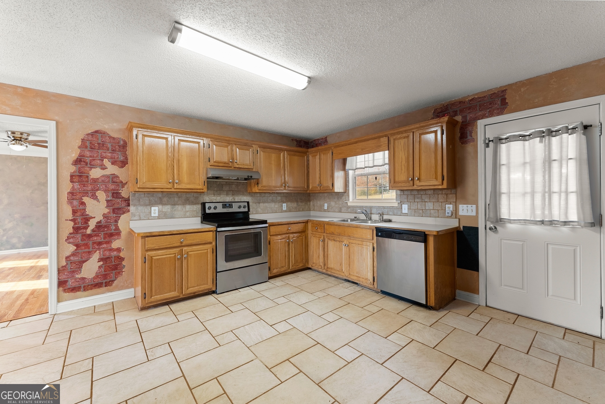 81 Heather Way Cleveland, GA 30528 - Photo 6 of 49 a kitchen with stainless steel appliances granite countertop a stove a sink and a microwave