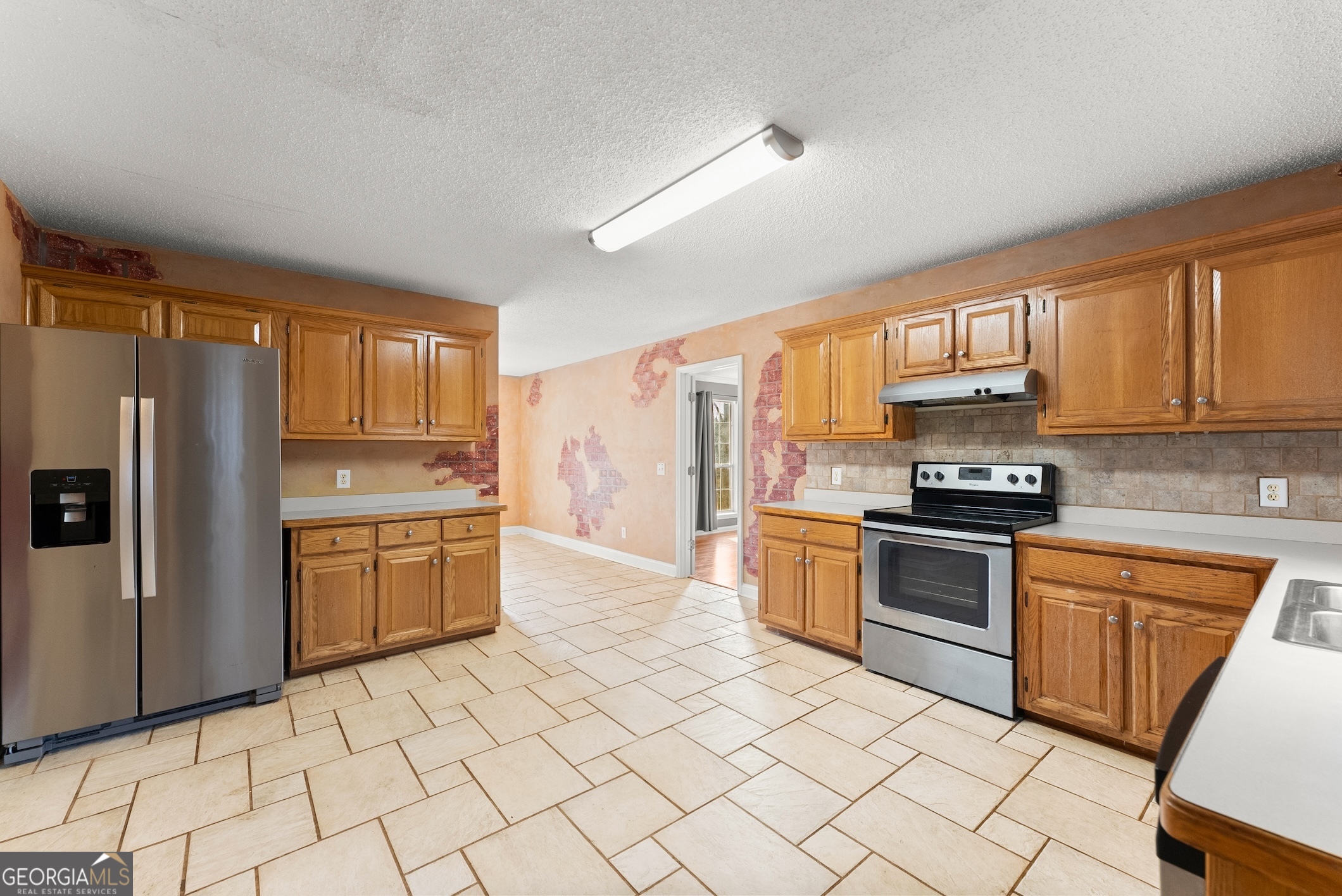 81 Heather Way Cleveland, GA 30528 - Photo 7 of 49 a kitchen with granite countertop a refrigerator stove top oven and sink