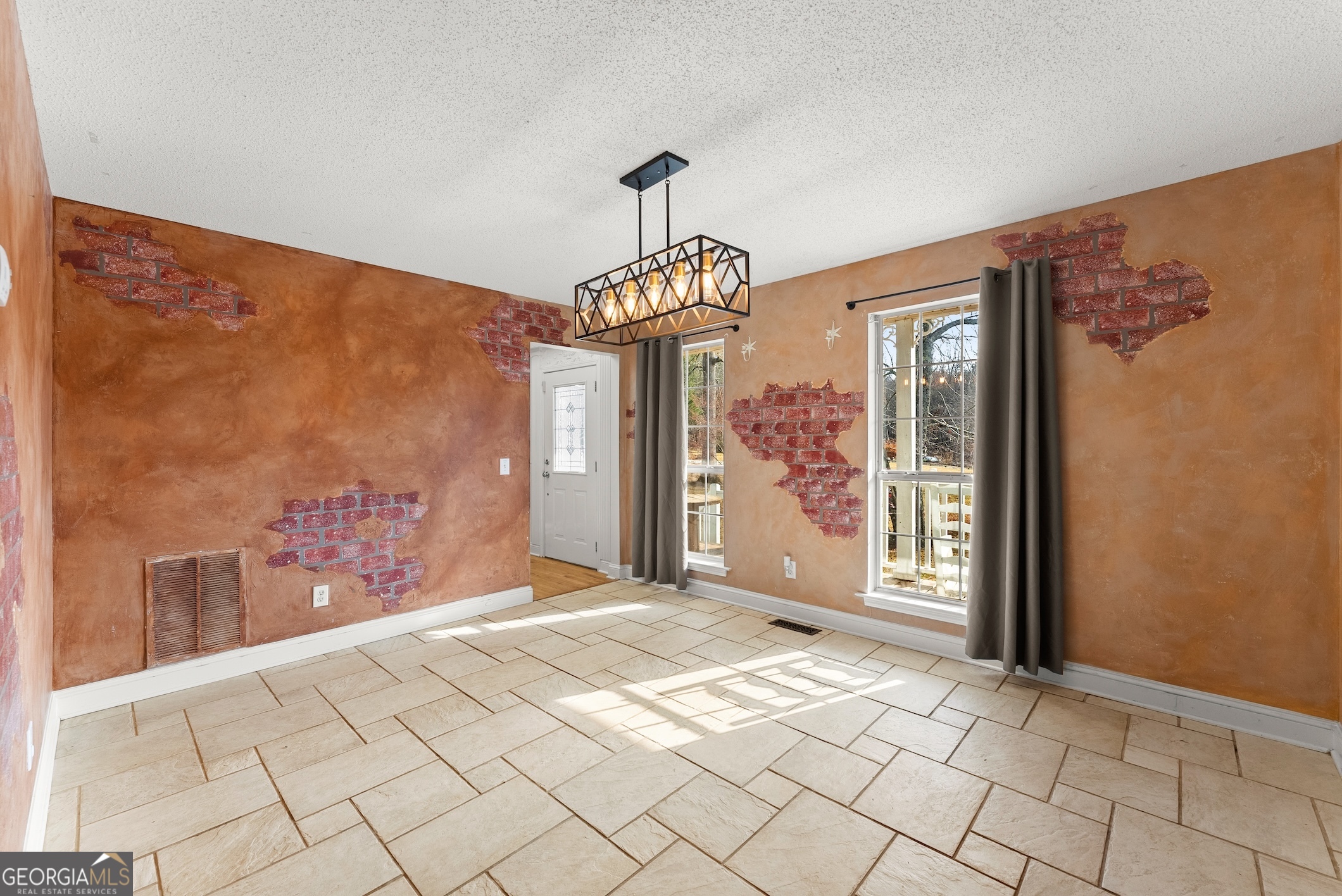 81 Heather Way Cleveland, GA 30528 - Photo 9 of 49 a view of a hallway with wooden floor and chandelier
