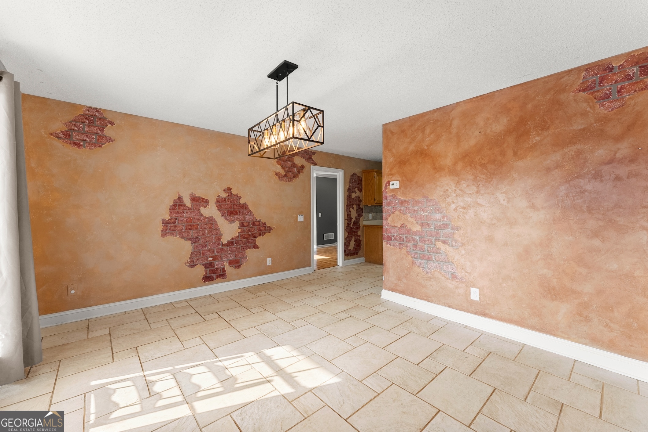 81 Heather Way Cleveland, GA 30528 - Photo 10 of 49 a view of a hallway with wooden floor and a chandelier