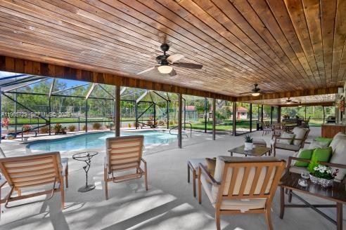 3761 Dellwood Road Loxahatchee, FL 33470 - Photo 31 of 55 Screened patio