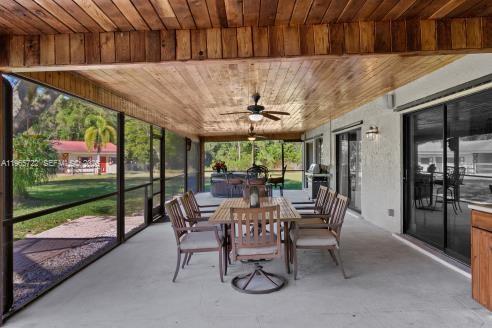 3761 Dellwood Road Loxahatchee, FL 33470 - Photo 32 of 55 Screened patio