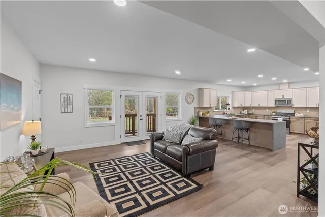 a living room with furniture and a table