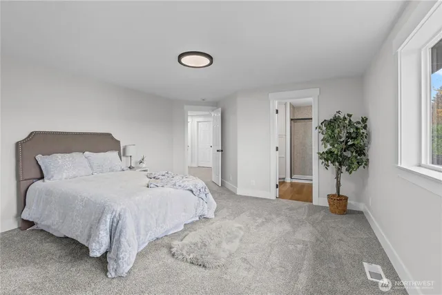 a bathroom with double sink and a mirror