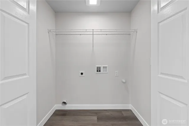 a view of a street with a house in background