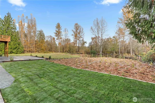 a view of a house with swimming pool and sitting area
