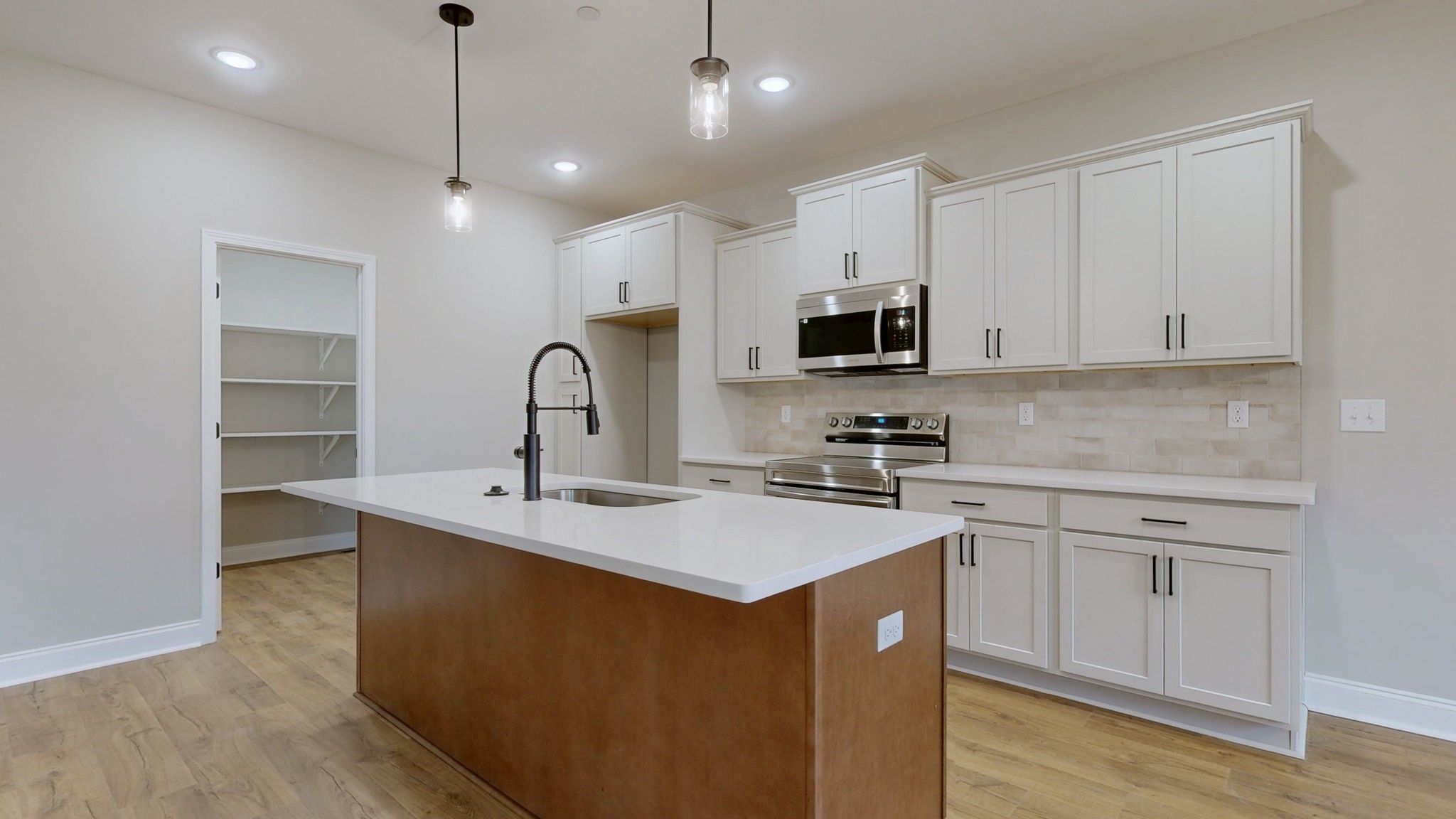 1417 Rooster Rdg Road Joelton, TN 37080 - Photo 3 of 24 a kitchen with kitchen island a sink stainless steel appliances and cabinets