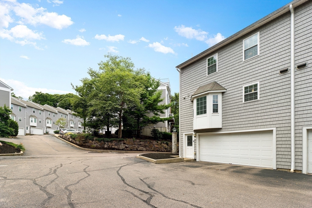 2 Ricciuti Drive, Unit 9 Quincy, MA 02169 - Photo 33 of 40 a view of a white house with many windows