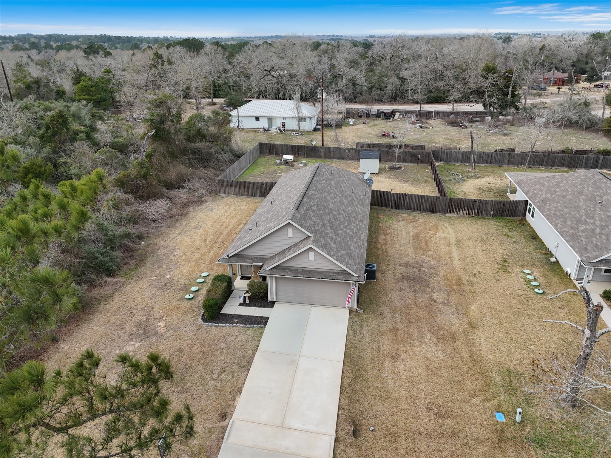 26431 Pin Oak Drive Hempstead, TX 77445 - Photo 29 of 32 Aerial view showing the home’s position on the lot with wooded surroundings for added privacy.