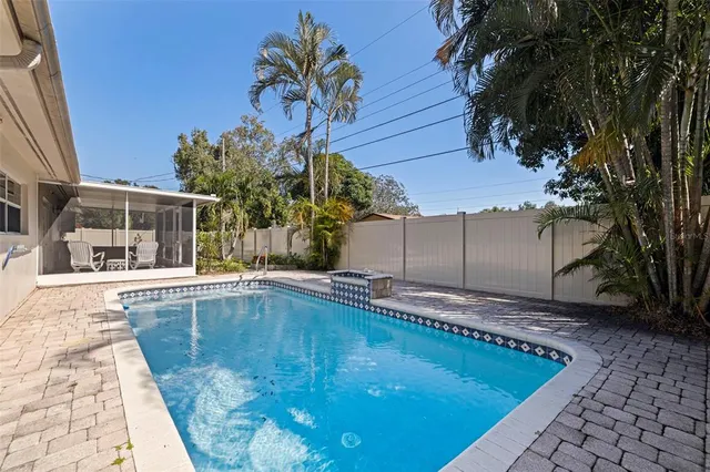 a view of a backyard with potted plants