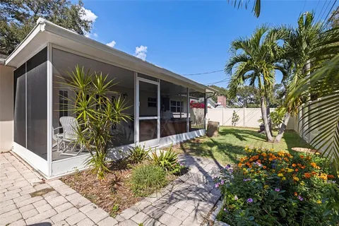 a room with lots of trees and furniture