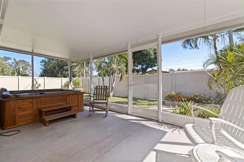 a backyard of a house with yard and outdoor seating