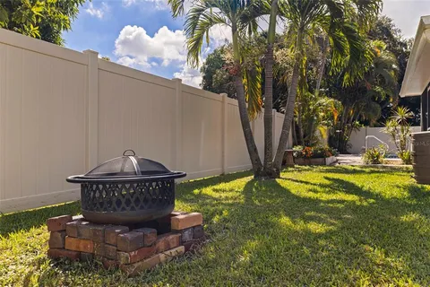 an aerial view of a house with a garden and a yard