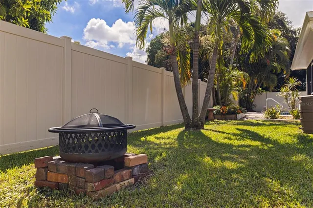 an aerial view of a house with a garden and a yard