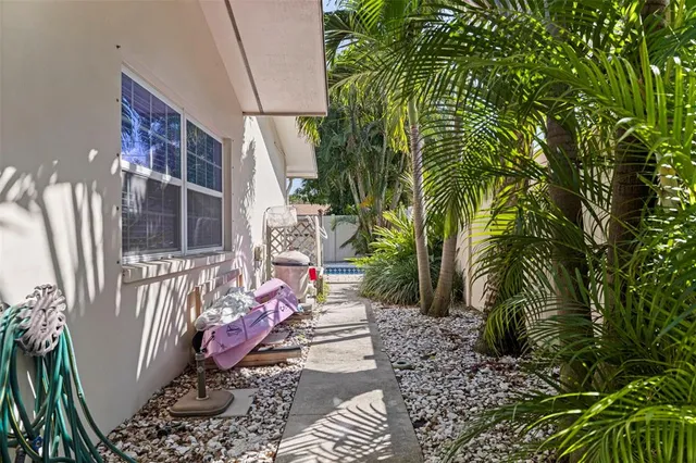 a view of a house with a yard and a garage