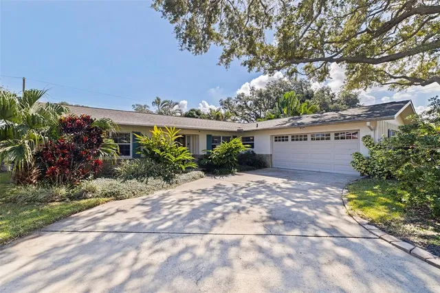 an aerial view of residential house and green space