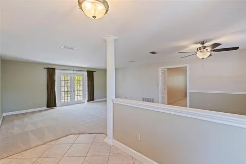 a view of an empty room with windows