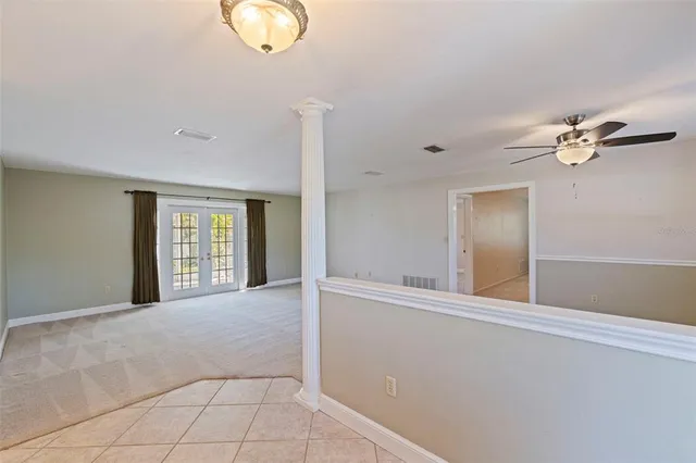 a view of an empty room with windows