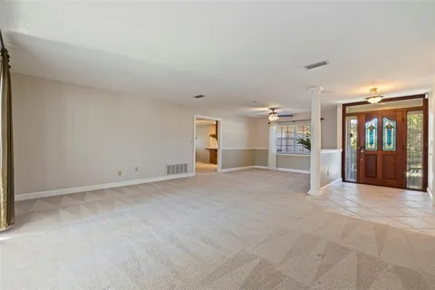 a view of a big room with wooden cabinet and refrigerator
