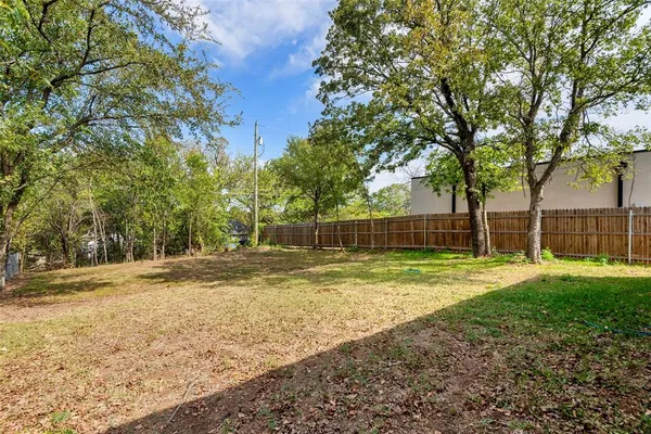 a view of a yard with of trees