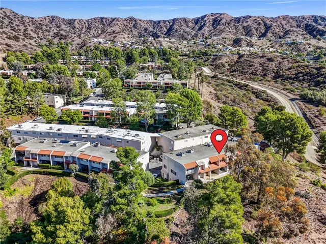 an aerial view of house with yard