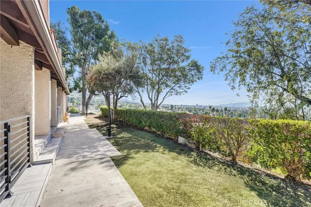 a view of a pathway both side of house