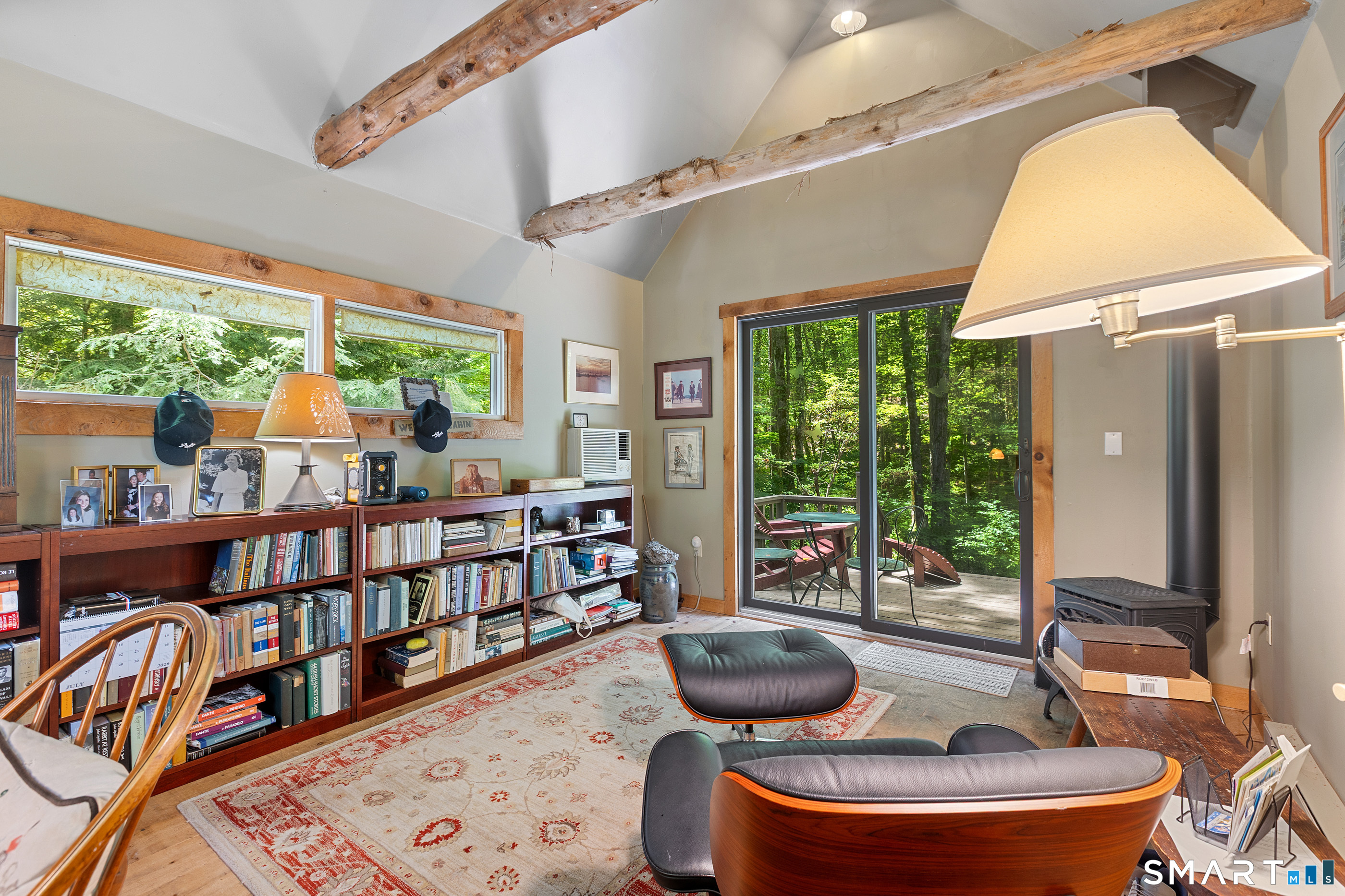 131 Georgetown Road Weston, CT 06883 - Photo 21 of 37 Studio Office with sliders for entrance to the wrap-around deck. Main features: vaulted ceiling with cedar and hemlock beams, rich pine floors, gas fireplace and baseboard heating.