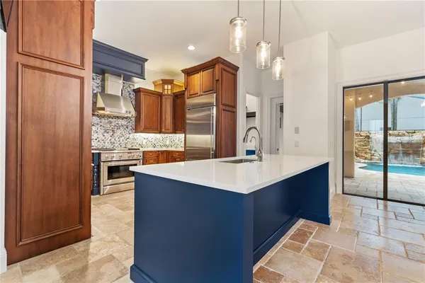 a bathroom with a sink and a large mirror