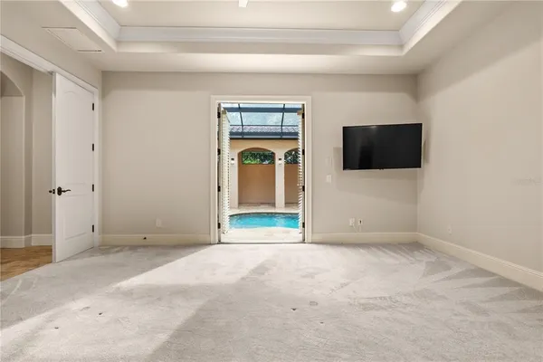 a spacious bathroom with a granite countertop sink mirror and a bathtub