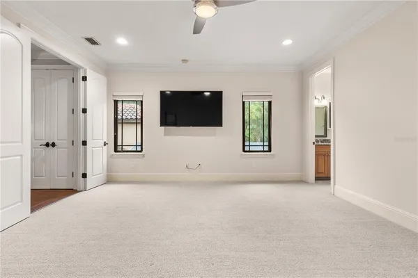 a bathroom with a granite countertop toilet sink and mirror