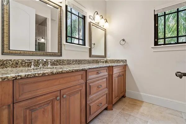 a view of a backyard with plants and trees