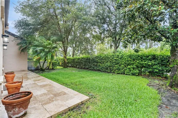 a view of a backyard with pathway