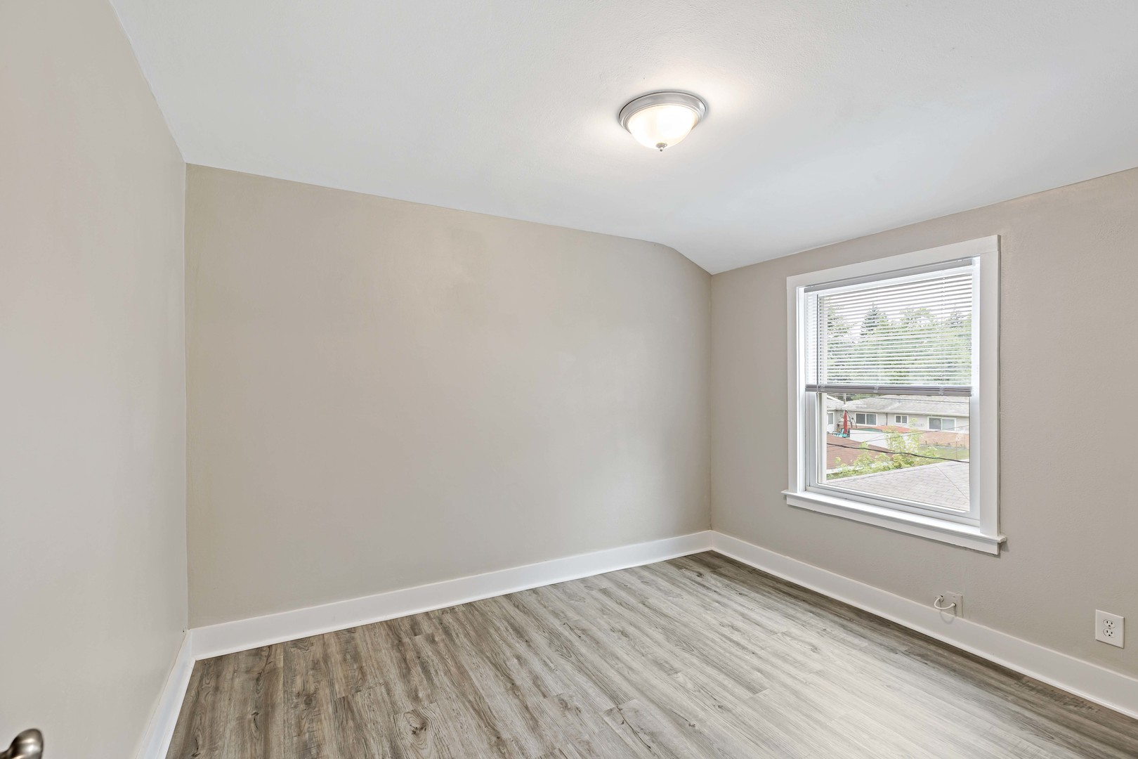 1404 Wentworth Avenue, Unit 1 Calumet City, IL 60409 - Photo 9 of 14 an empty room with a window