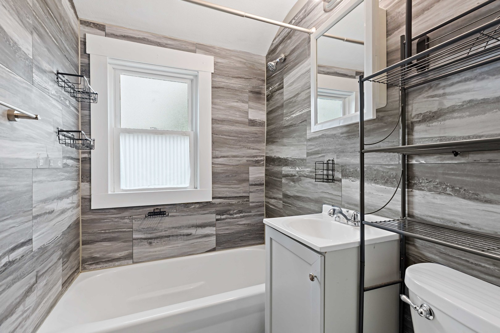 1404 Wentworth Avenue, Unit 1 Calumet City, IL 60409 - Photo 10 of 14 a bathroom with a sink a toilet and shower